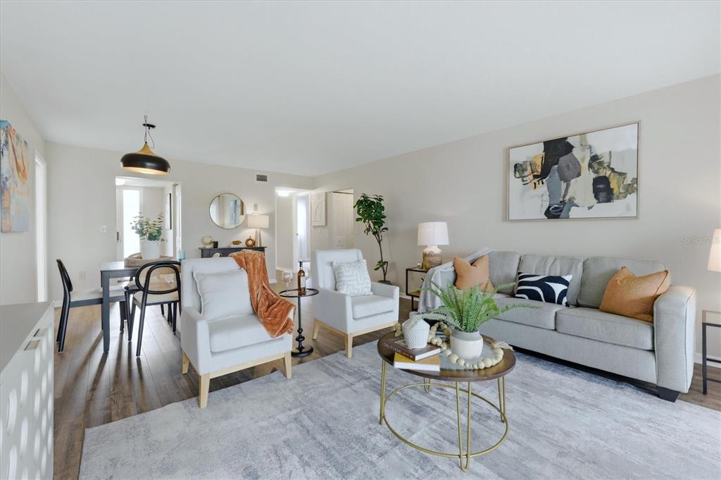 5058 Marsh Field Road, Unit 8 Sarasota, FL 34235 - Photo 8 of 73 a living room with furniture and a large window