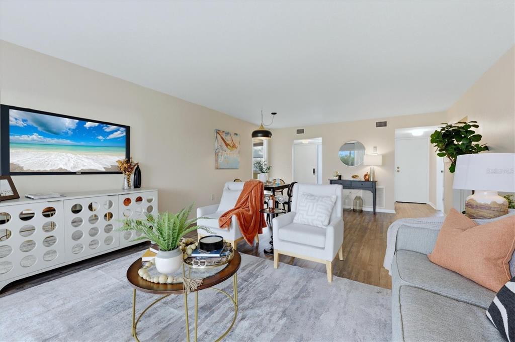 5058 Marsh Field Road, Unit 8 Sarasota, FL 34235 - Photo 10 of 73 a living room with furniture and wooden floor