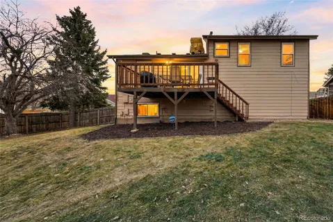 a balcony view with a large window and wooden floor