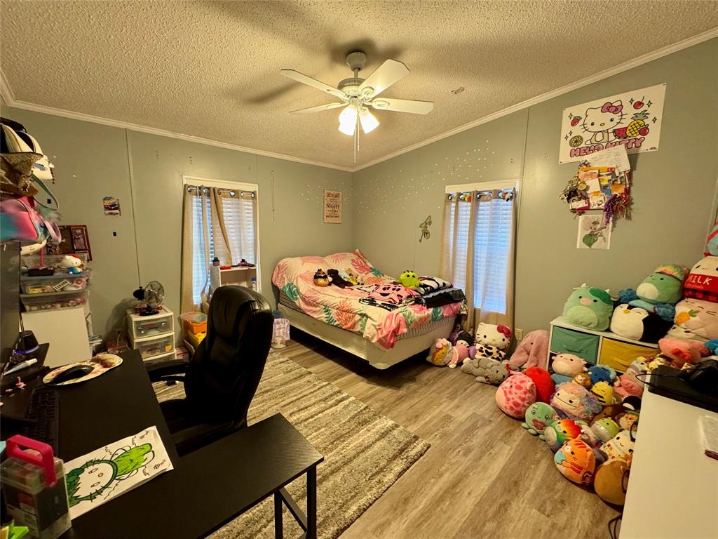 19580 Northwest 80th Drive Okeechobee, FL 34972 - Photo 17 of 34 a bedroom with bed or couch and a window