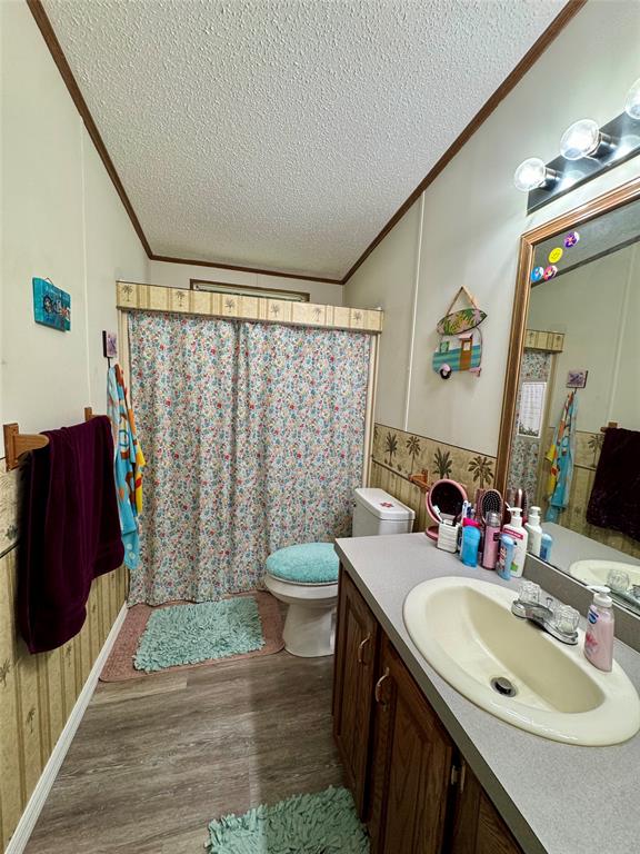 19580 Northwest 80th Drive Okeechobee, FL 34972 - Photo 19 of 34 a bathroom with a sink toilet and shower