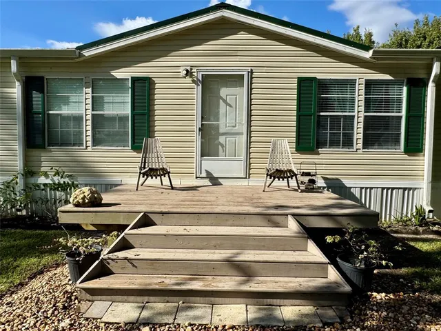 a front view of house with outdoor seating