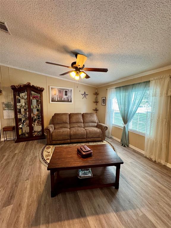 19580 Northwest 80th Drive Okeechobee, FL 34972 - Photo 21 of 34 a living room with furniture and wooden floor
