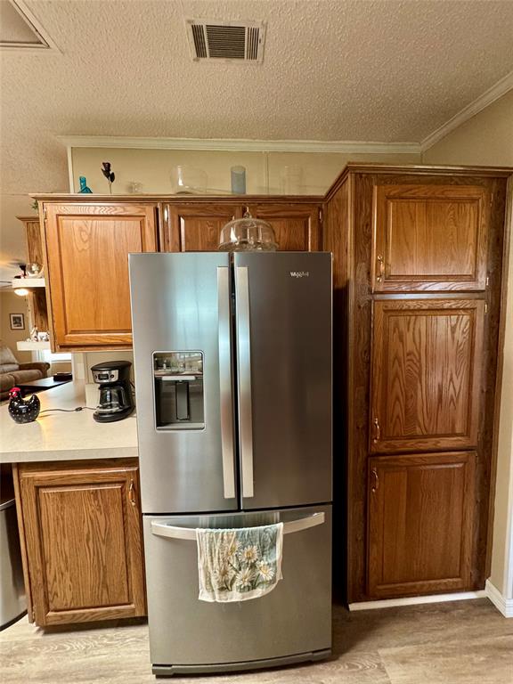 19580 Northwest 80th Drive Okeechobee, FL 34972 - Photo 28 of 34 a kitchen with stainless steel appliances granite countertop a refrigerator and a stove