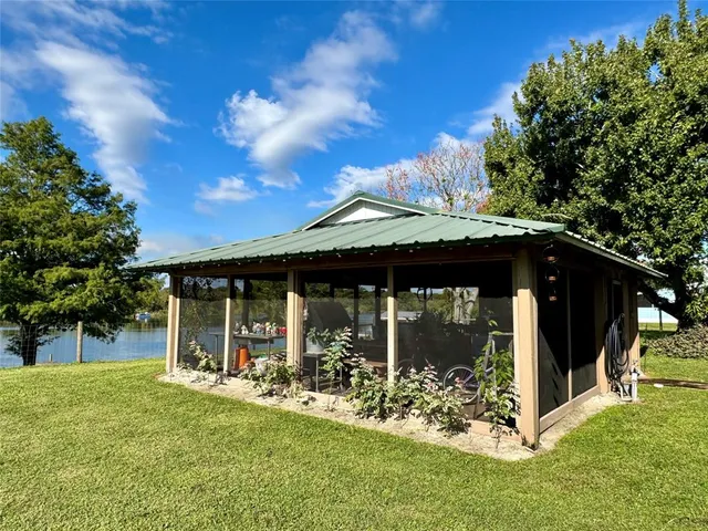 a view of a garden with a bench in the garden