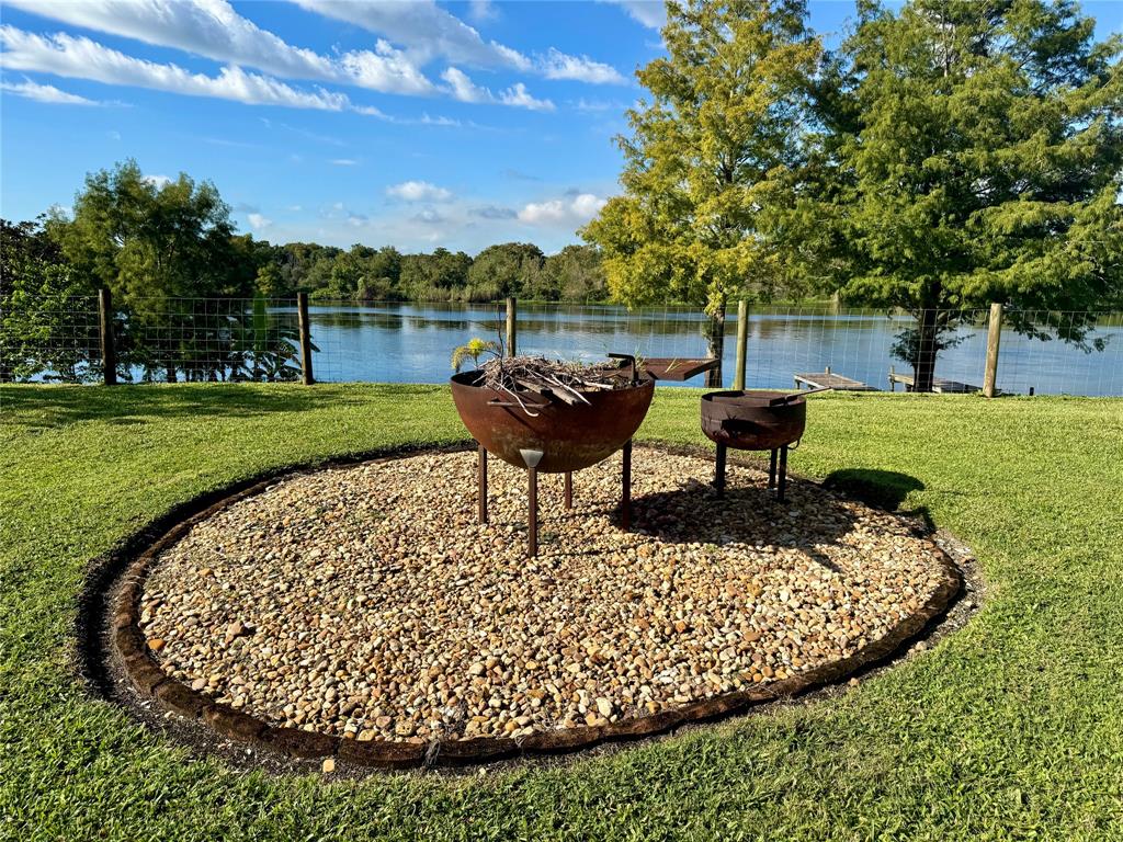 19580 Northwest 80th Drive Okeechobee, FL 34972 - Photo 8 of 34 a view of a garden with a bench in the garden