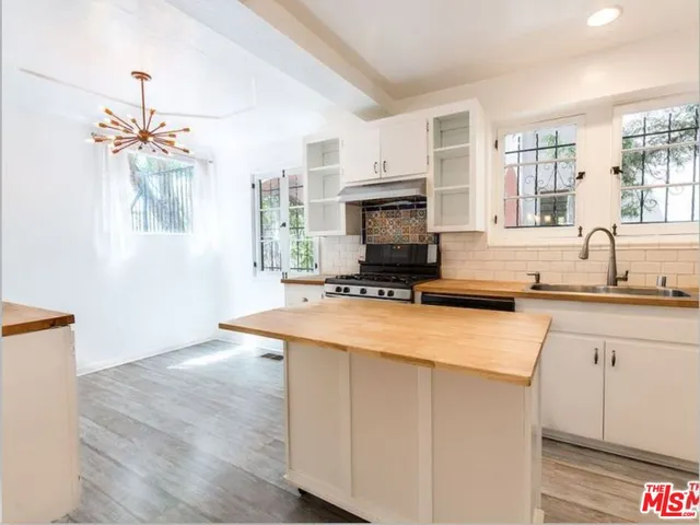 a bathroom with a tub and a shower