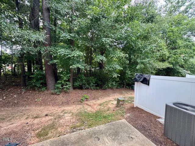 a view of house with backyard