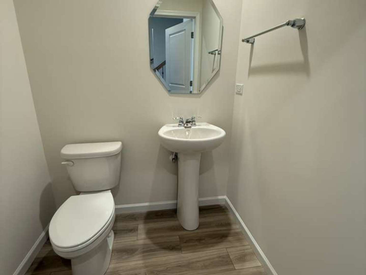 672 Switchgrass Way, Unit 58005 Bolingbrook, IL 60490 - Photo 16 of 19 a bathroom with a toilet a sink and a mirror