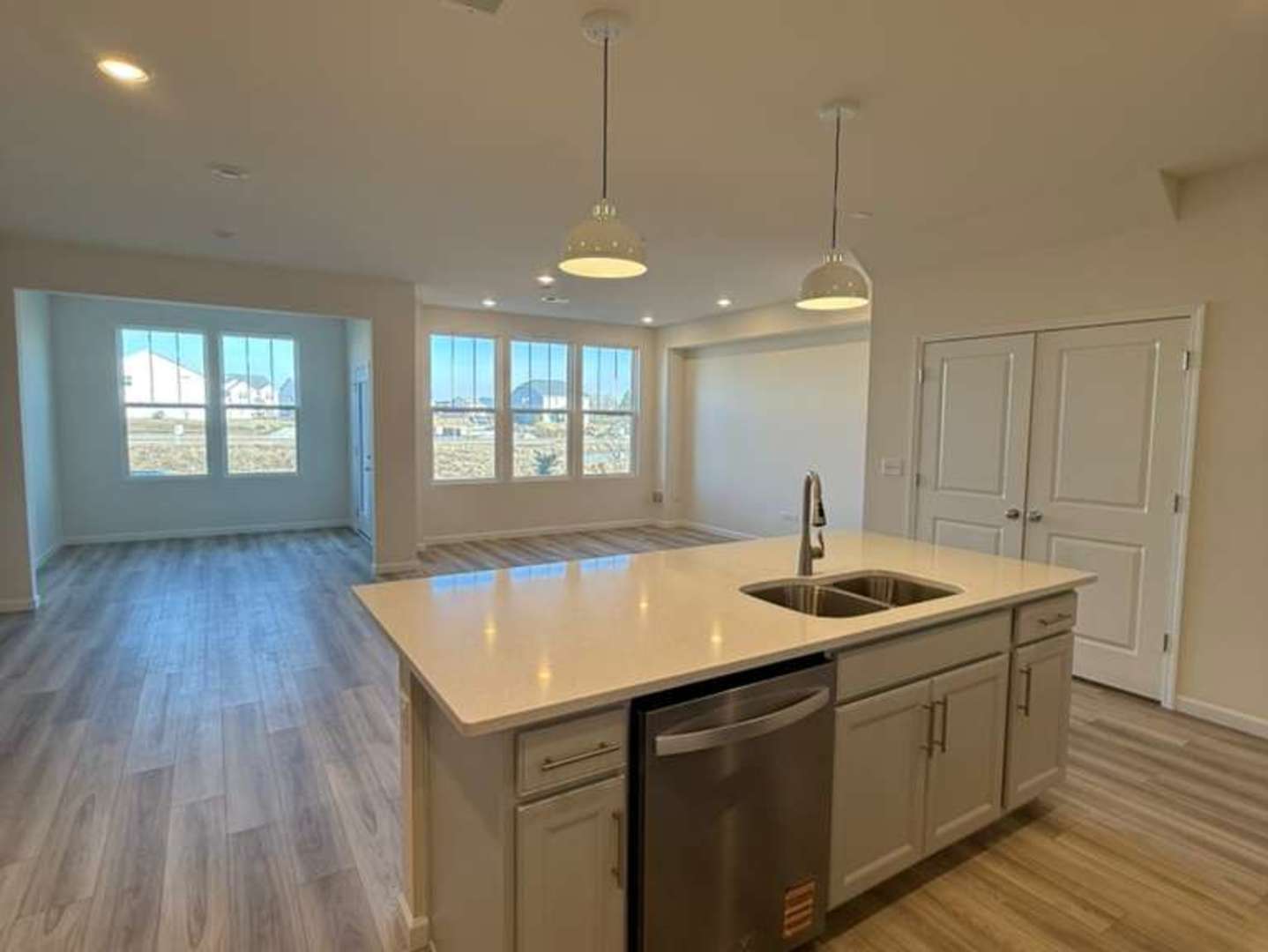 672 Switchgrass Way, Unit 58005 Bolingbrook, IL 60490 - Photo 3 of 19 a kitchen with a sink and stove