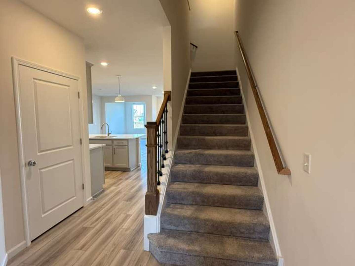 672 Switchgrass Way, Unit 58005 Bolingbrook, IL 60490 - Photo 7 of 19 a view of entryway and hall with wooden floor