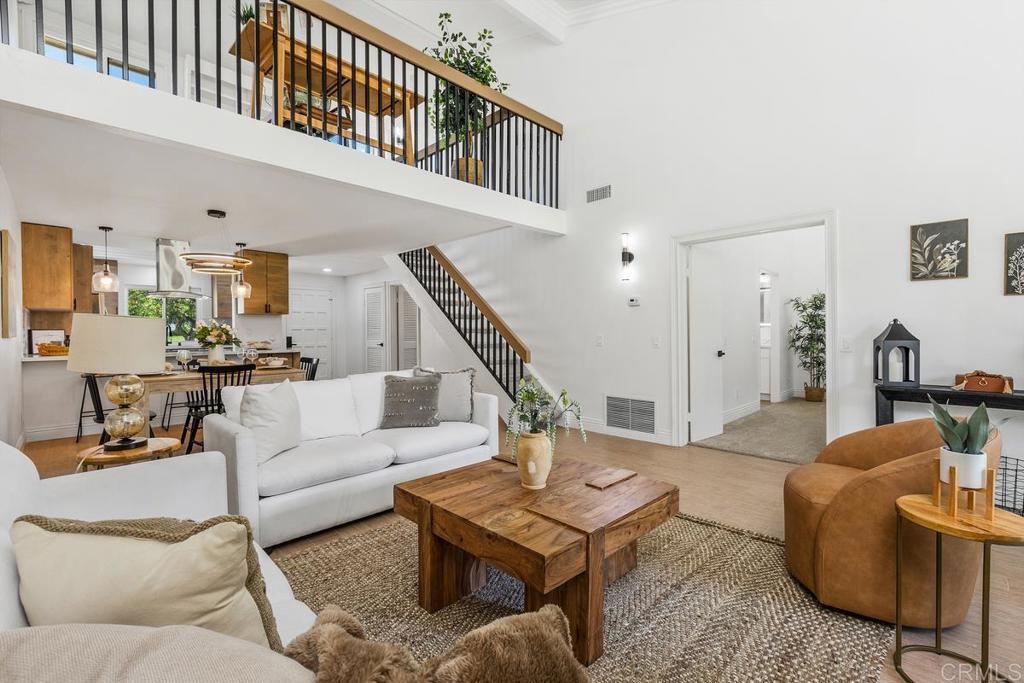13611 Penina Street Poway, CA 92064 - Photo 13 of 30 a living room with furniture a rug and a table
