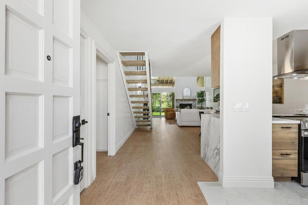 13611 Penina Street Poway, CA 92064 - Photo 3 of 30 a view of a living room with furniture and a flat screen tv