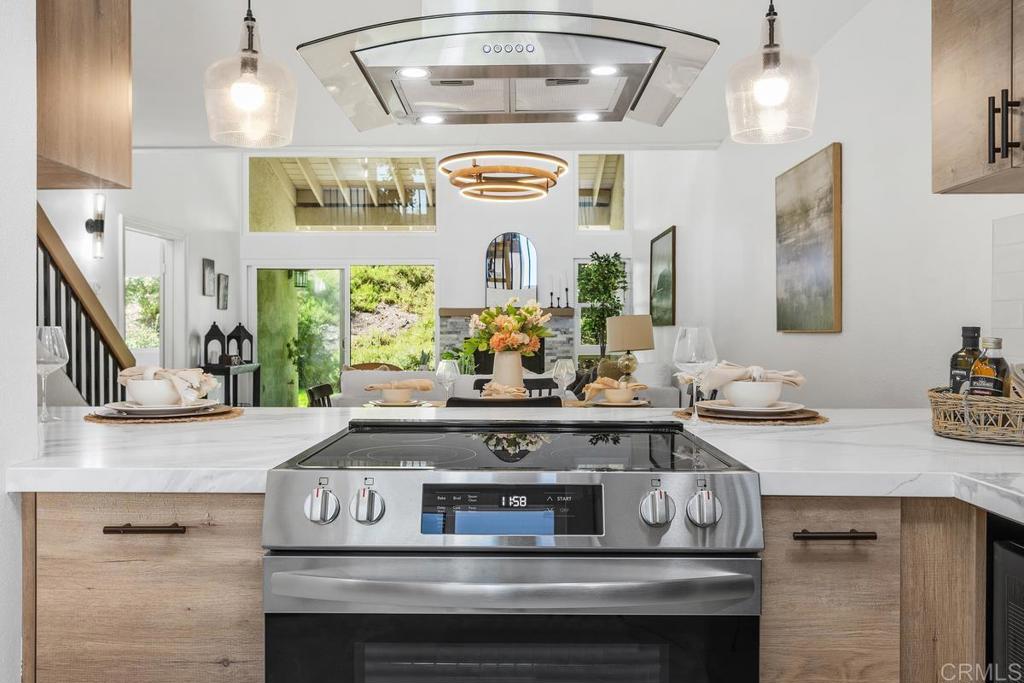 13611 Penina Street Poway, CA 92064 - Photo 5 of 30 a view of living room with granite countertop furniture and fireplace