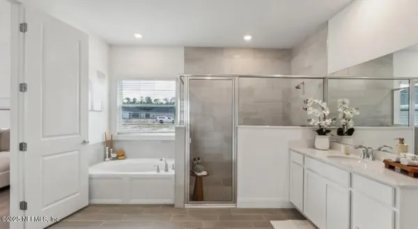a bathroom with a sink vanity and mirror