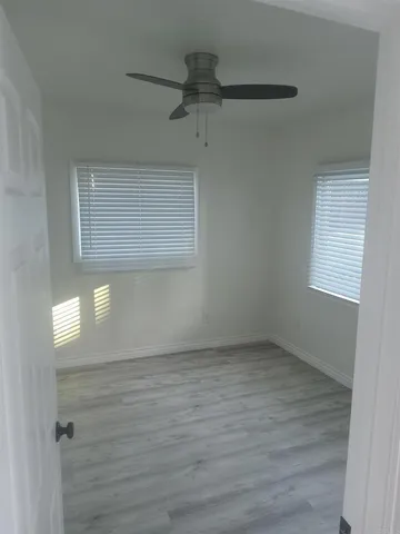 a view of an empty room with a window