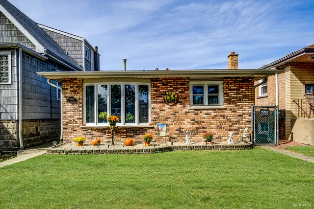 front view of a house with a yard