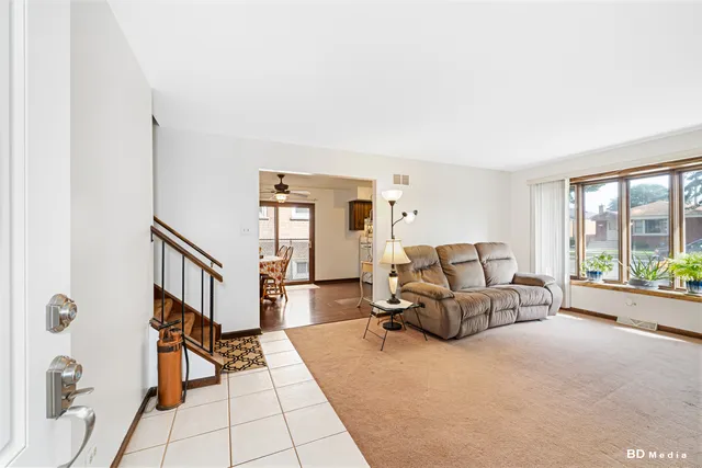 a bed room with furniture and a window