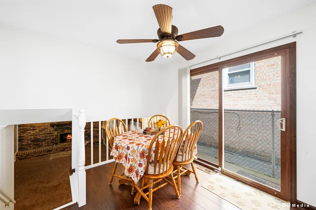 a dining room with furniture and a window