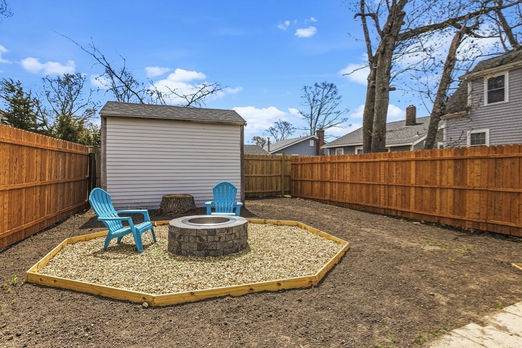 8 Cottage Street Wareham, MA 02571 - Photo 23 of 30 a backyard of a house with table and chairs