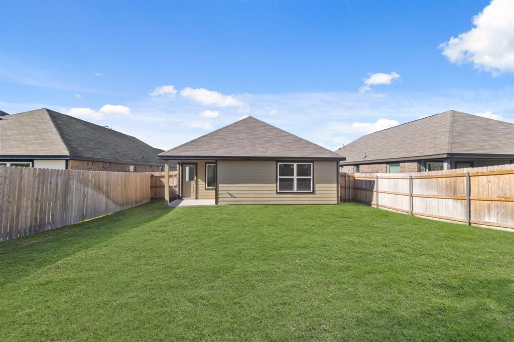 1505 Romans Road Ennis, TX 75119 - Photo 12 of 13 a front view of a house with a yard