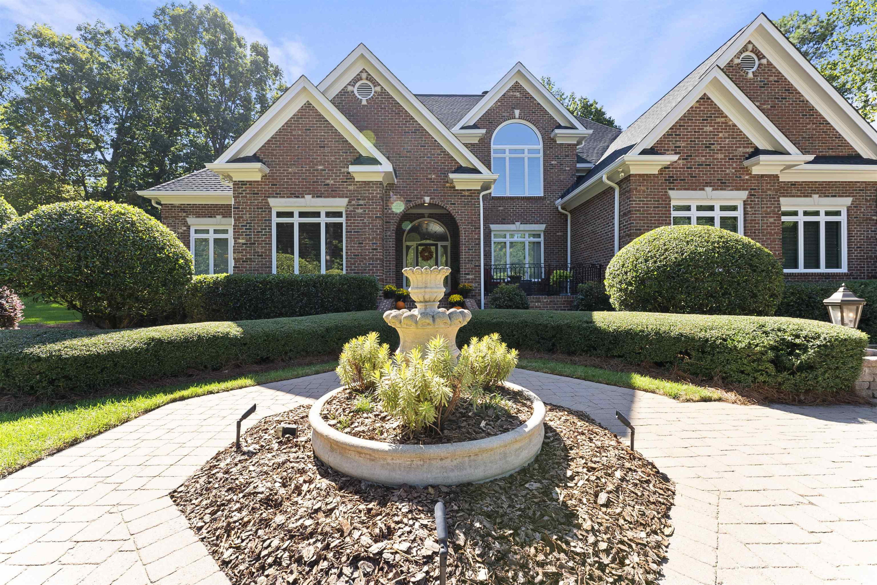 11301 Brass Kettle Road Raleigh, NC 27614 - Photo 5 of 79 a front view of a house with a yard and potted plants