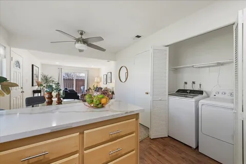 a kitchen with sink stove and refrigerator