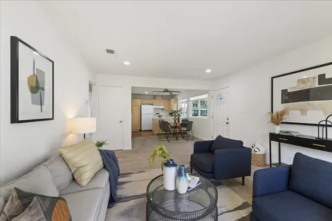 a living room with furniture or couch and a flat screen tv