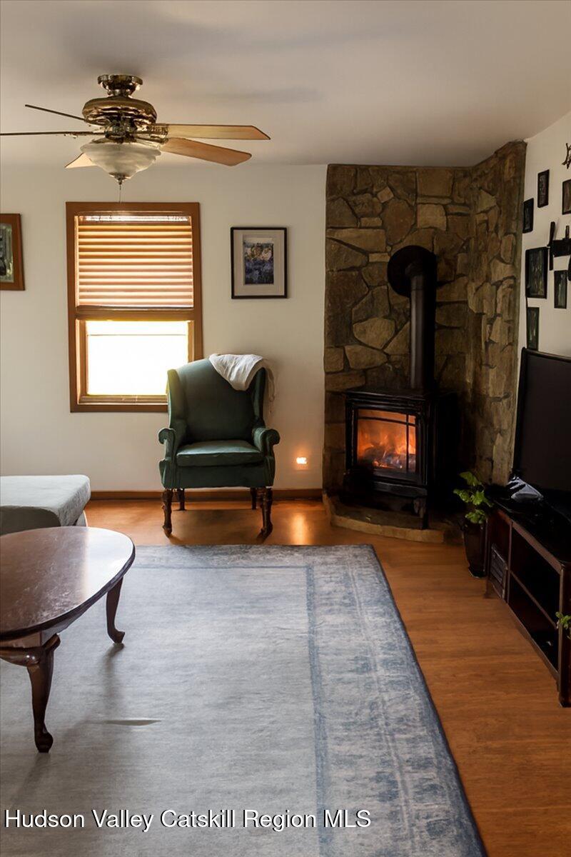 266 Scheller Park Road West Coxsackie, NY 12192 - Photo 24 of 26 a living room with furniture and a fireplace