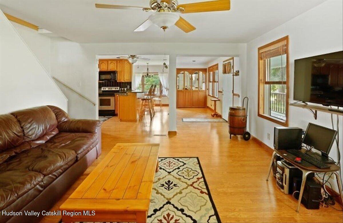 266 Scheller Park Road West Coxsackie, NY 12192 - Photo 3 of 26 a living room with furniture and a flat screen tv