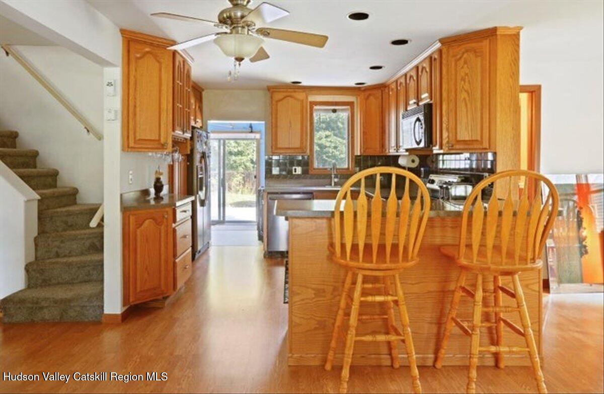 266 Scheller Park Road West Coxsackie, NY 12192 - Photo 5 of 26 a view of a hallway with wooden floor and windows