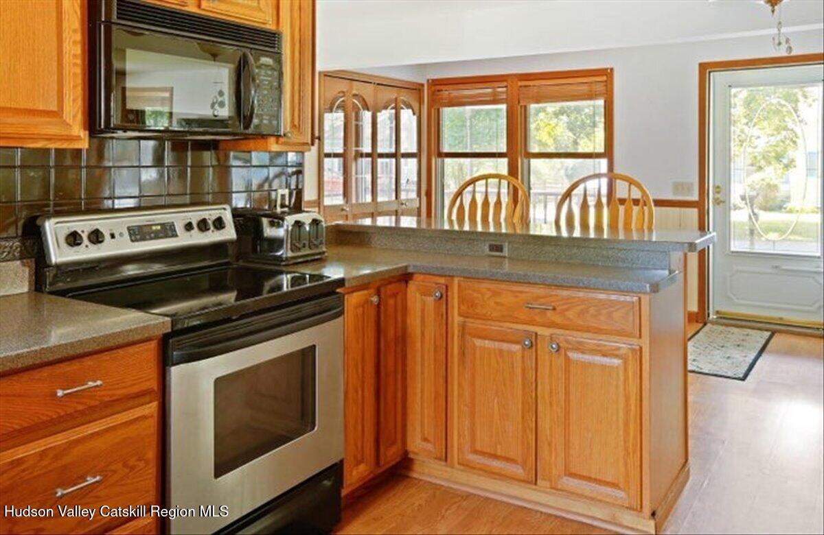 266 Scheller Park Road West Coxsackie, NY 12192 - Photo 6 of 26 a stove top oven sitting inside of a kitchen