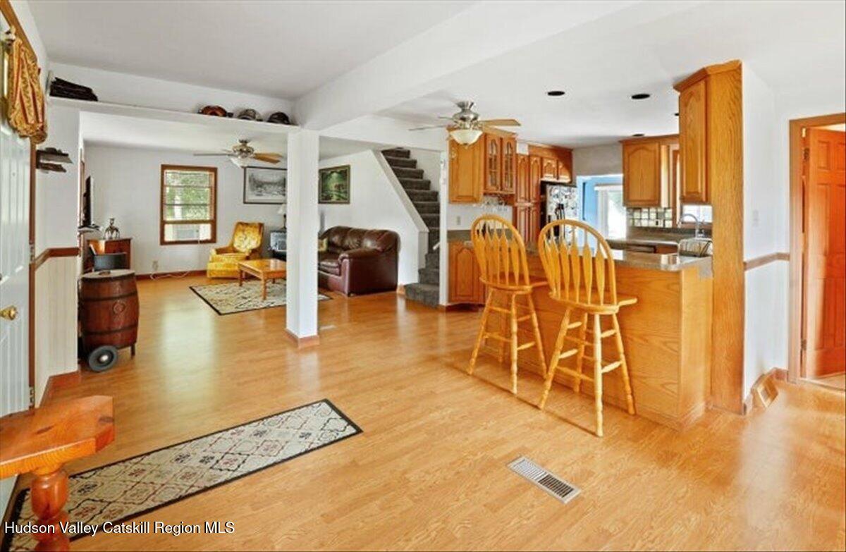 266 Scheller Park Road West Coxsackie, NY 12192 - Photo 10 of 26 a living room with lots of gym equipment