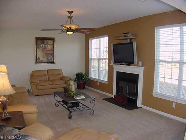 4706 Ridge Fall Road Greensboro, NC 27410 - Photo 4 of 9 Other. Large Den in back w/Cozy Fireplace is Wired for Plasma TV and Surround Sound has Door on right out to Patio