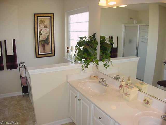 4706 Ridge Fall Road Greensboro, NC 27410 - Photo 8 of 9 Other. Master Bath has Jacuzzi brand Jetted Tub w/Glassblock Window, 4-ft separate Shower and Double Sink Vanities