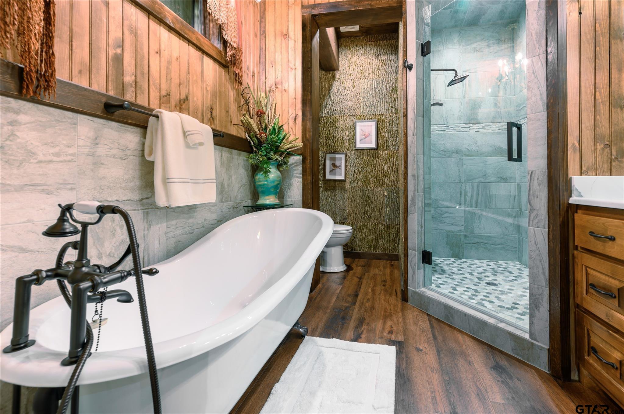 1450 County Road Sumner, TX 75486 - Photo 17 of 35 a bathroom with a bathtub and shower
