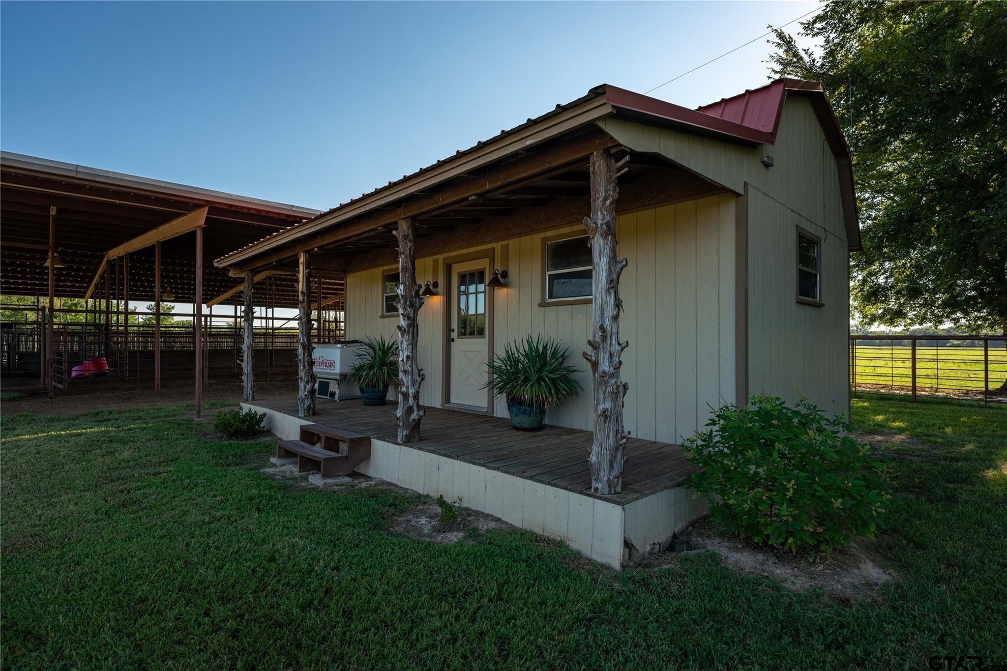 1450 County Road Sumner, TX 75486 - Photo 26 of 35 a front view of a house with garden
