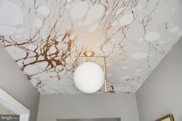 a kitchen with a stove a sink a refrigerator and a dining table