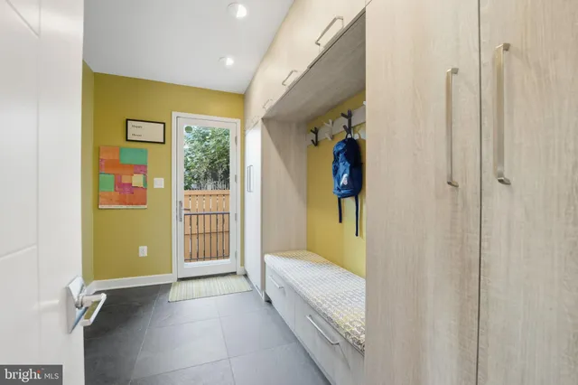 a kitchen with a sink and a refrigerator