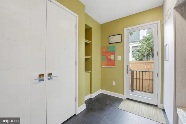a kitchen with stainless steel appliances white cabinets and a sink