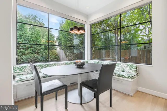 a view of staircase with white walls and white door