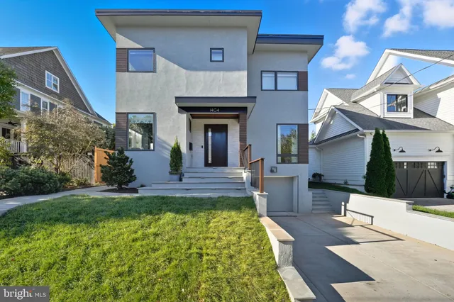 a view of a house with a swimming pool and furniture