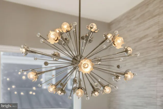 a bedroom with a large bed and a painting on the wall