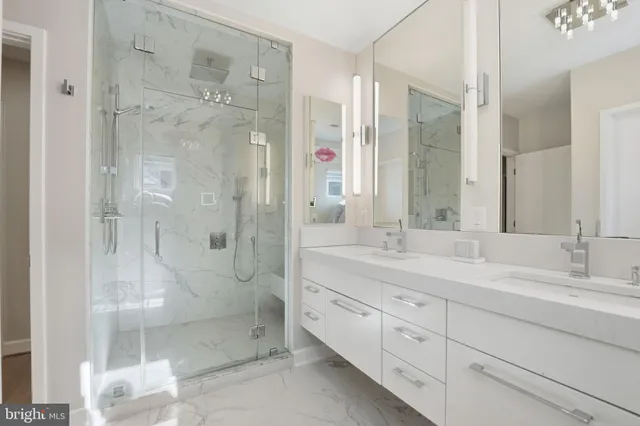 a en suite bathroom with a sink a toilet and shower