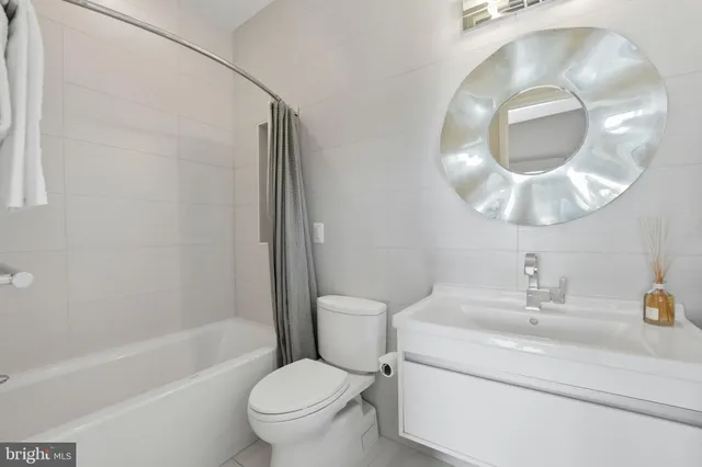 a picture of a bathroom with a shower