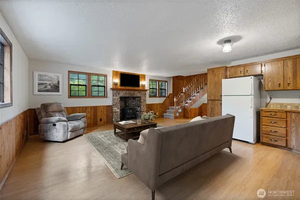 a living room with furniture fireplace and a flat screen tv
