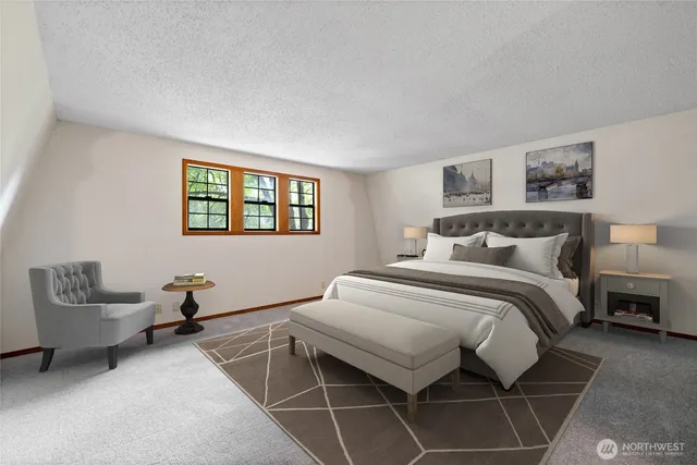 a bedroom with a bed and a couch