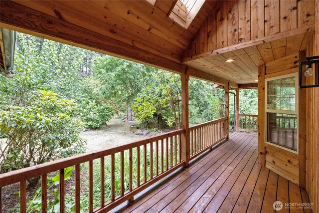 a view of balcony with wooden floor