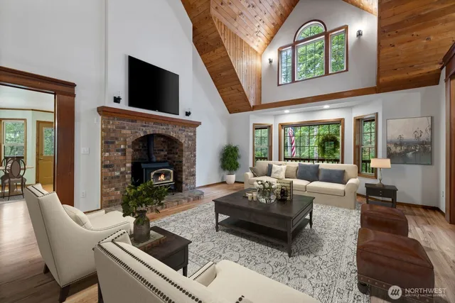 a living room with furniture flat screen tv and a fireplace