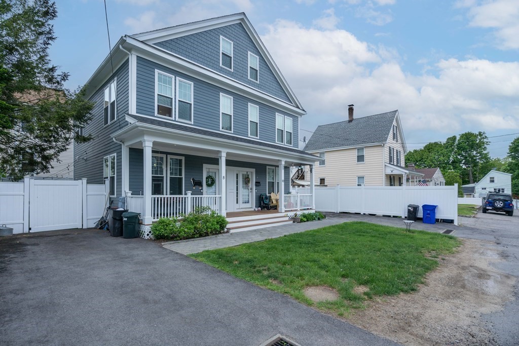 8 Loring Place, Unit 8 Boston, MA 02136 - Photo 1 of 23 a front view of a house with a yard and porch